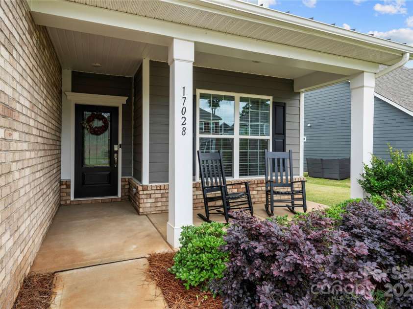 17028 River Race Drive, Huntersville, NC 28078.  MLS# CAR4259977, YatesRealty ID 23397. Rocking chair front porch