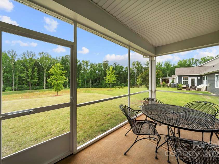 17028 River Race Drive, Huntersville, NC 28078.  MLS# CAR4259977, YatesRealty ID 23397. Screened porch is perfect for your morning coffee