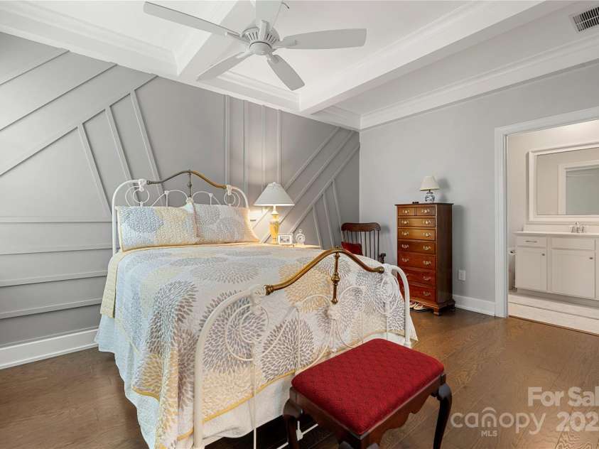 17028 River Race Drive, Huntersville, NC 28078.  MLS# CAR4259977, YatesRealty ID 23397. Second suite features a sitting area, coffered ceiling and board and batten accent wall