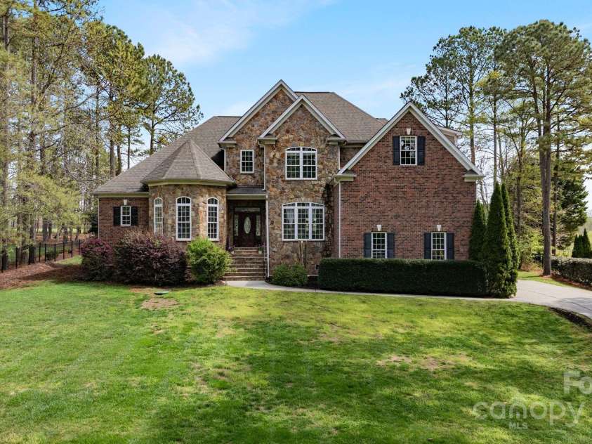 116 Whispering Cove Court, Mooresville, NC 28117.  MLS# CAR4242039, YatesRealty ID 23399. Perched on top of a hill