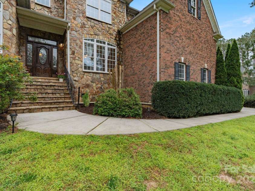 116 Whispering Cove Court, Mooresville, NC 28117.  MLS# CAR4242039, YatesRealty ID 23399. Stone Front Entry
