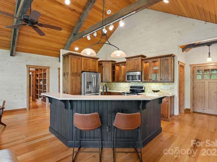 147 Brantley Branch Lane, Waynesville, NC 28786.  MLS# CAR4275100, YatesRealty ID 23400. Breakfast bar on large kitchen island