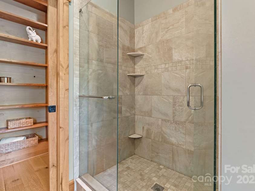 147 Brantley Branch Lane, Waynesville, NC 28786.  MLS# CAR4275100, YatesRealty ID 23400. Walk-in tile shower