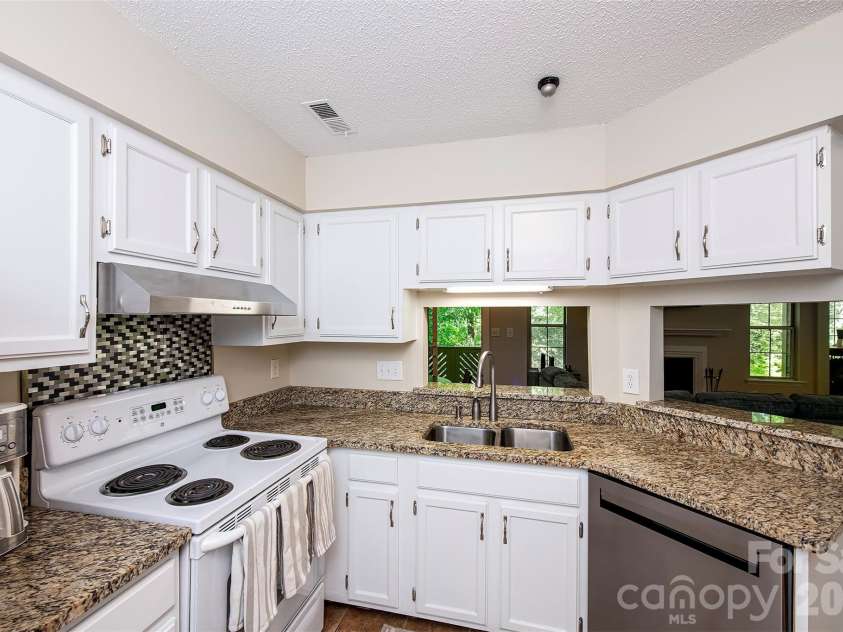 6500 Clavell Lane, Charlotte, NC 28210.  MLS# CAR4379511, YatesRealty ID 23401. Freshly painted kitchen with granite