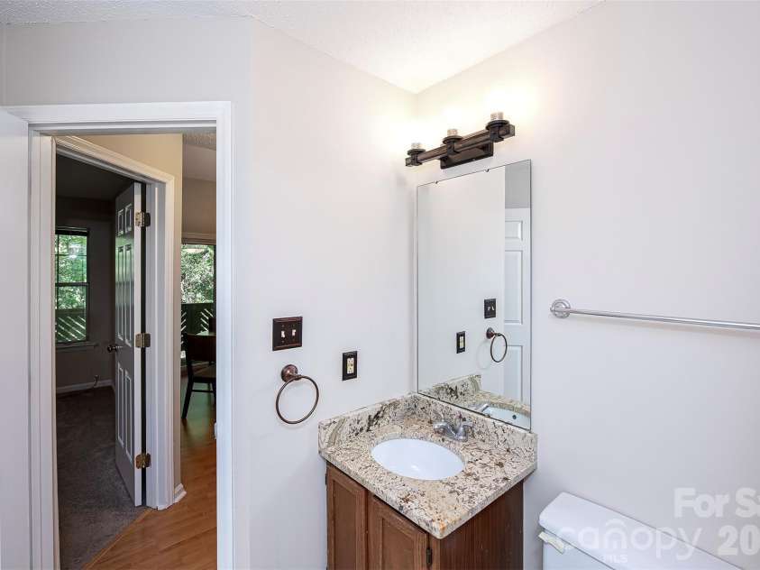 6500 Clavell Lane, Charlotte, NC 28210.  MLS# CAR4379511, YatesRealty ID 23401. Half Bath with toilet and sink