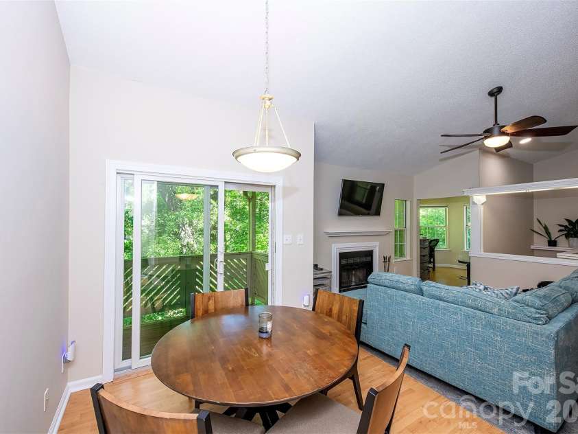 6500 Clavell Lane, Charlotte, NC 28210.  MLS# CAR4379511, YatesRealty ID 23401. Open dining to den with vaulted ceilings