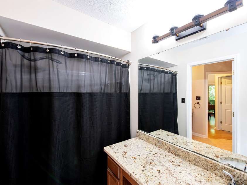 6500 Clavell Lane, Charlotte, NC 28210.  MLS# CAR4379511, YatesRealty ID 23401. Other half with sink and shower