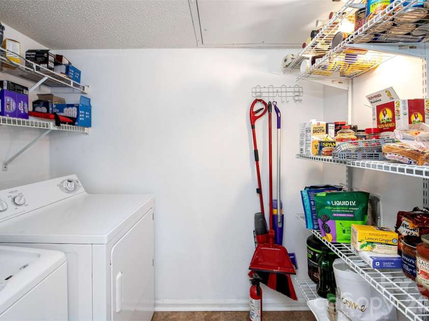 6500 Clavell Lane, Charlotte, NC 28210.  MLS# CAR4379511, YatesRealty ID 23401. Pantry + Laundry