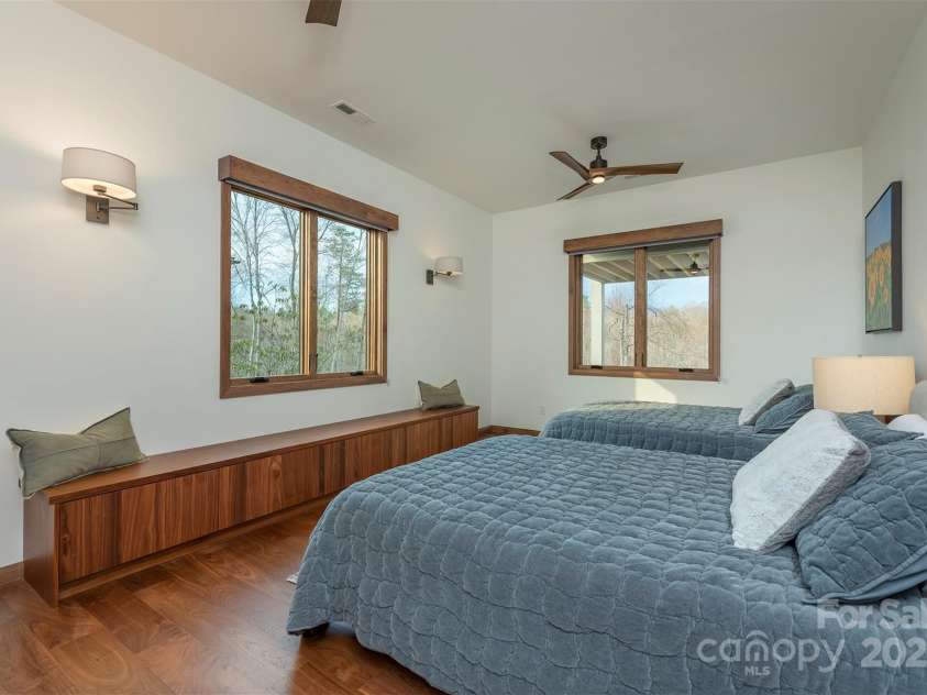 158 Riverbend Forest Drive, Asheville, NC 28805.  MLS# CAR4240684, YatesRealty ID 23402. Lower level guest bedroom