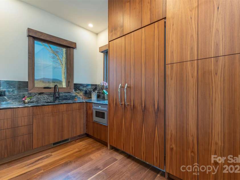 158 Riverbend Forest Drive, Asheville, NC 28805.  MLS# CAR4240684, YatesRealty ID 23402. Pantry room with custom refrigerator doors and extensive built-ins