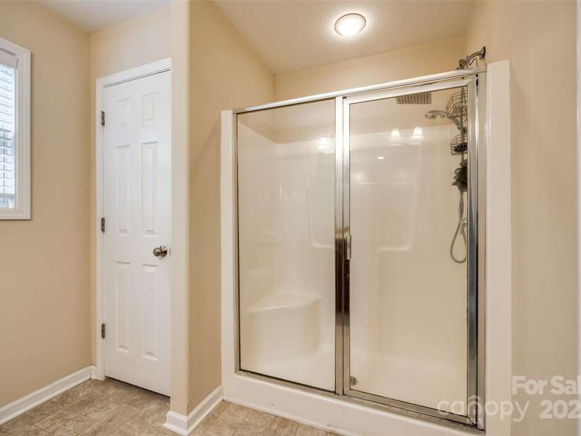 1206 Craig Avenue, Lancaster, SC 29720.  MLS# CAR4264315, YatesRealty ID 23404. Walk-in shower in primary bathroom