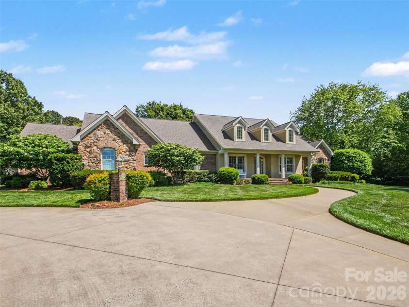 1422 Stone Gate Drive, Shelby, NC 28150.  MLS# CAR4358985, YatesRealty ID 23404. French provincial architecture with brick and stone accents on a level 1.75 acre private lot...
