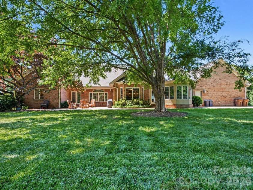 1422 Stone Gate Drive, Shelby, NC 28150.  MLS# CAR4358985, YatesRealty ID 23404. Patio with fire pit is accessed from primary bedroom, kitchen, and sunroom!  Wonderful outdoor living area!
