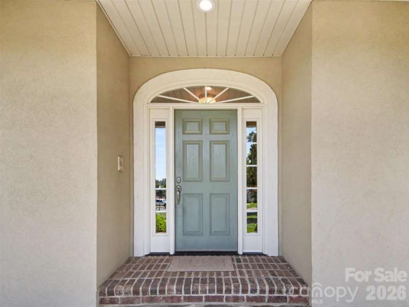 1422 Stone Gate Drive, Shelby, NC 28150.  MLS# CAR4358985, YatesRealty ID 23404. The front door with a beautiful arched casing is very inviting!
