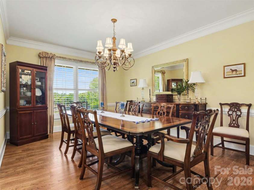 1422 Stone Gate Drive, Shelby, NC 28150.  MLS# CAR4358985, YatesRealty ID 23404. To the left of the foyer is the cheerful dining room. All draperies remain.