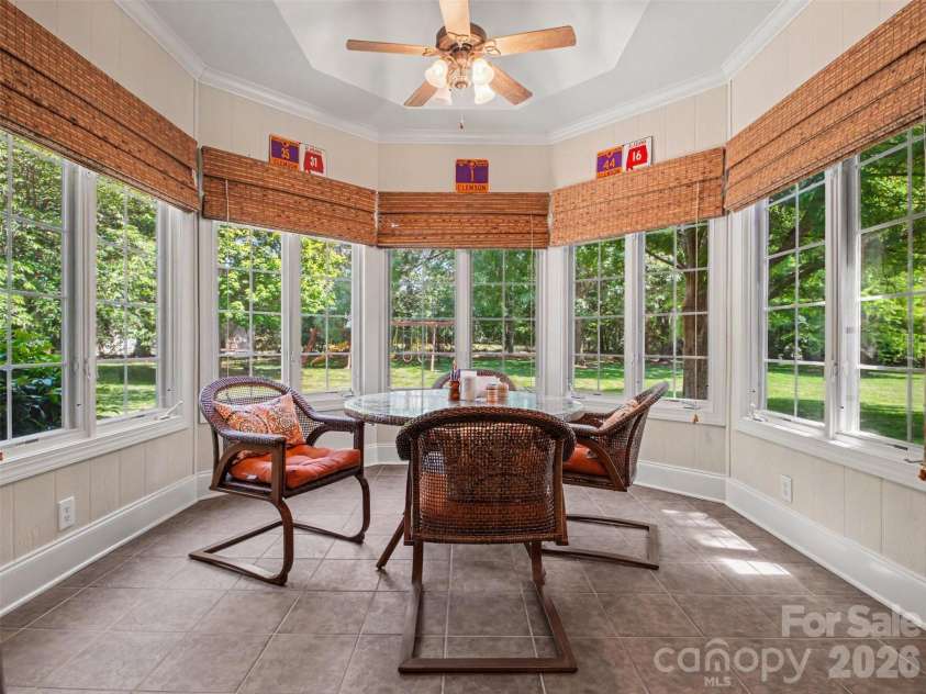 1422 Stone Gate Drive, Shelby, NC 28150.  MLS# CAR4358985, YatesRealty ID 23404. Windows surround the sunroom and fill the space with abundant natural light while offering relaxing views of the back yard.