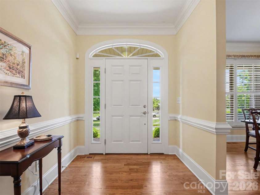 1422 Stone Gate Drive, Shelby, NC 28150.  MLS# CAR4358985, YatesRealty ID 23404. You enter into a wide foyer with thick molding and gleaming hardwood floors.
