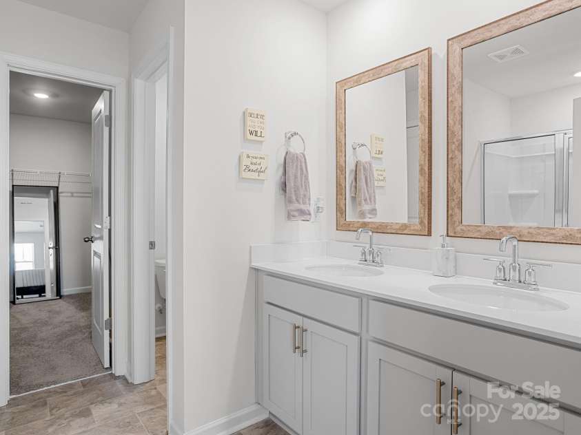 7007 Manse Court, Boiling Springs, SC 29316.  MLS# CAR4260062, YatesRealty ID 23409. In the en-suite you will find double vanity sinks