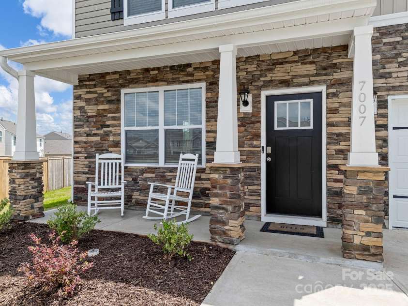 7007 Manse Court, Boiling Springs, SC 29316.  MLS# CAR4260062, YatesRealty ID 23409. Relax on your front porch