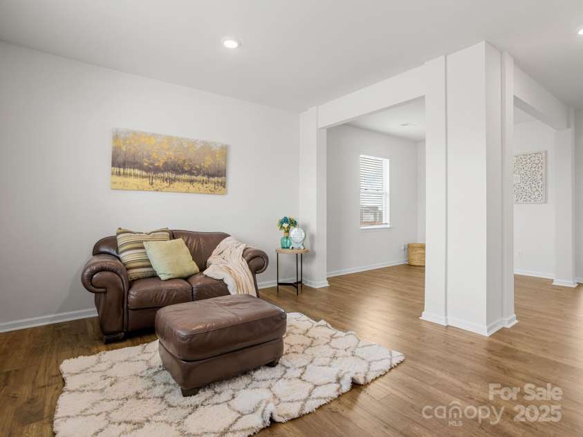 7007 Manse Court, Boiling Springs, SC 29316.  MLS# CAR4260062, YatesRealty ID 23409. The living room leads to the dining room