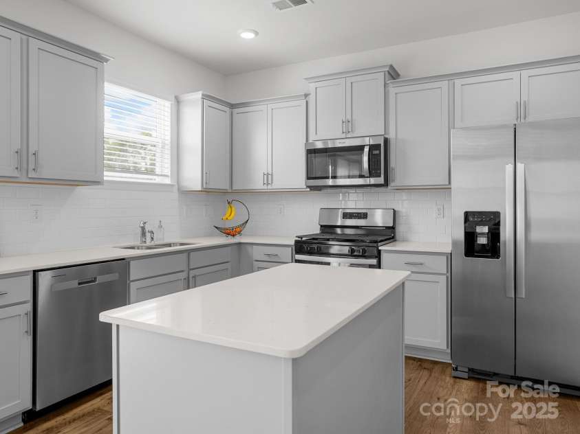 7007 Manse Court, Boiling Springs, SC 29316.  MLS# CAR4260062, YatesRealty ID 23409. Your dream kitchen with an island that has storage.