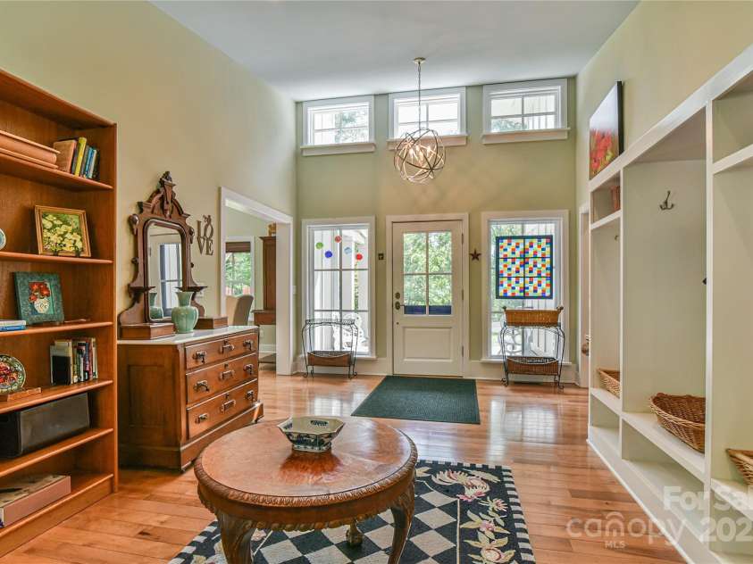 63 Greenridge Road, Weaverville, NC 28787.  MLS# CAR4268175, YatesRealty ID 23413. At the front door, pause to take in the warmth of the light in the entry.