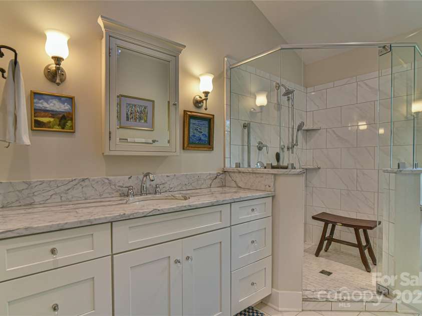 63 Greenridge Road, Weaverville, NC 28787.  MLS# CAR4268175, YatesRealty ID 23413. En-suite bath 1 features custom walk-in shower.