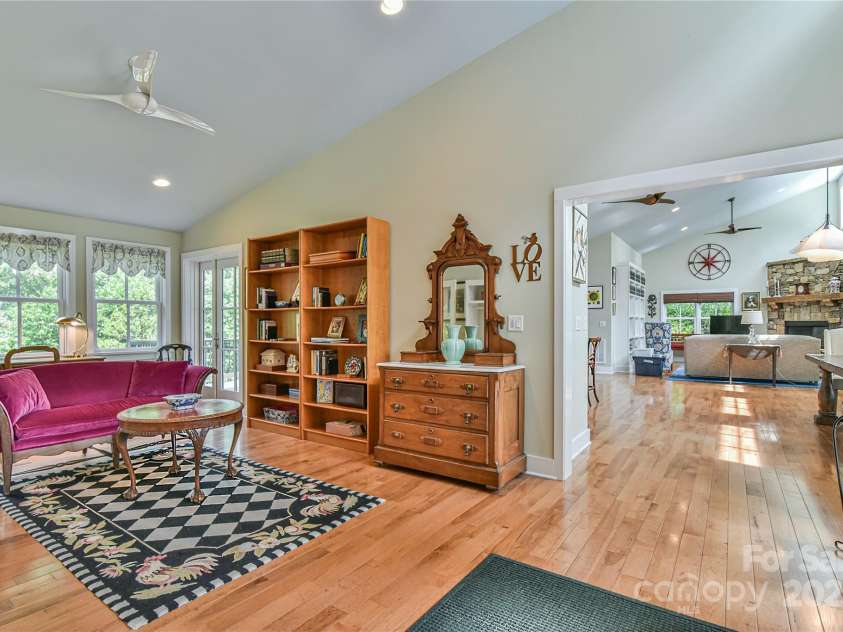 63 Greenridge Road, Weaverville, NC 28787.  MLS# CAR4268175, YatesRealty ID 23413. Enter the home into a spacious family room / flex room, which connects to main living area and bedrooms.