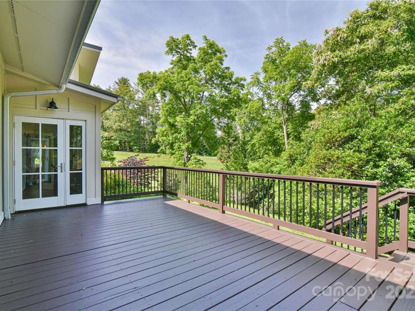 63 Greenridge Road, Weaverville, NC 28787.  MLS# CAR4268175, YatesRealty ID 23413. Newly stained/sealed rear deck with steps down to the yard.