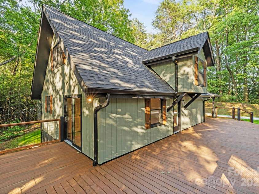 327 Flat Ridge Drive, Lake Toxaway, NC 28774.  MLS# CAR4270374, YatesRealty ID 23416. Bedroom sliding door to deck