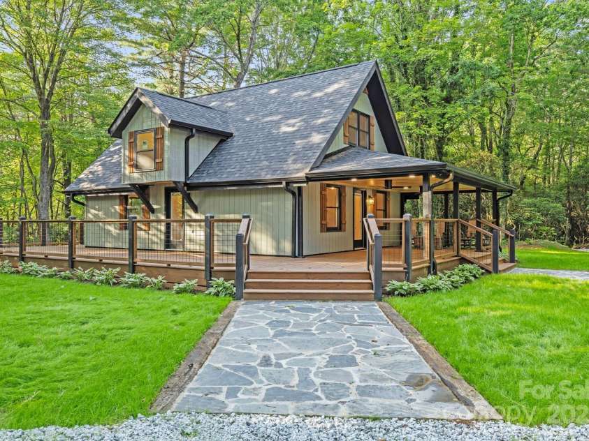 327 Flat Ridge Drive, Lake Toxaway, NC 28774.  MLS# CAR4270374, YatesRealty ID 23416. Flag stone pathway side entrance