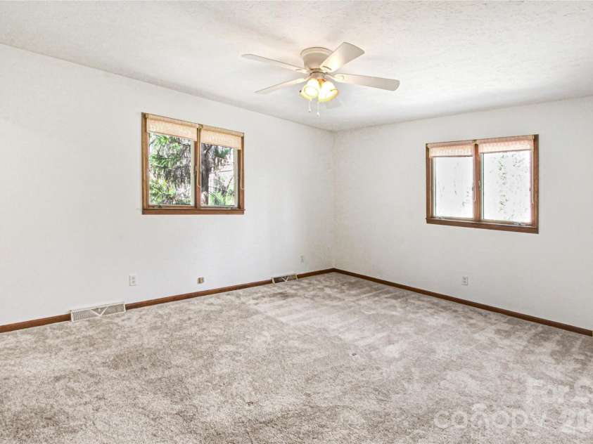 540 Chickadee Lane, Brevard, NC 28712.  MLS# CAR4363992, YatesRealty ID 23422. Main Level - Primary Bedroom
