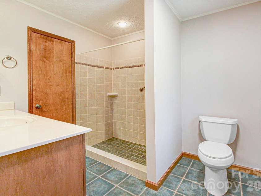 540 Chickadee Lane, Brevard, NC 28712.  MLS# CAR4363992, YatesRealty ID 23422. Primary Bath