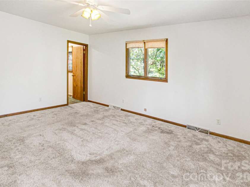 540 Chickadee Lane, Brevard, NC 28712.  MLS# CAR4363992, YatesRealty ID 23422. Primary Bedroom