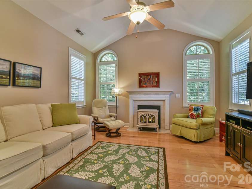 11 Outlook Circle, Swannanoa, NC 28778.  MLS# CAR4380390, YatesRealty ID 23426. Cozy Franklin Stove gas fireplace and wood shutters.