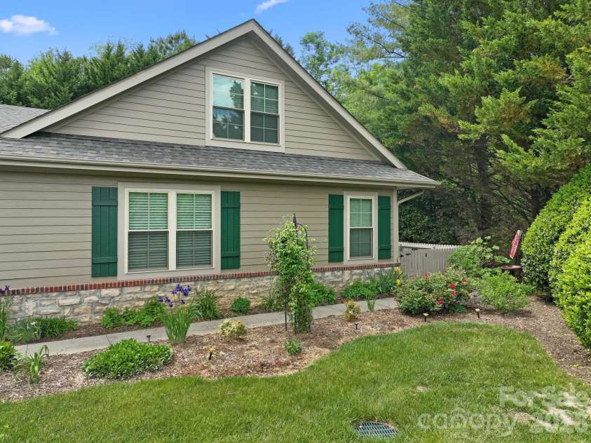11 Outlook Circle, Swannanoa, NC 28778.  MLS# CAR4380390, YatesRealty ID 23426. Lovely perennial flowers line the path to the front door.