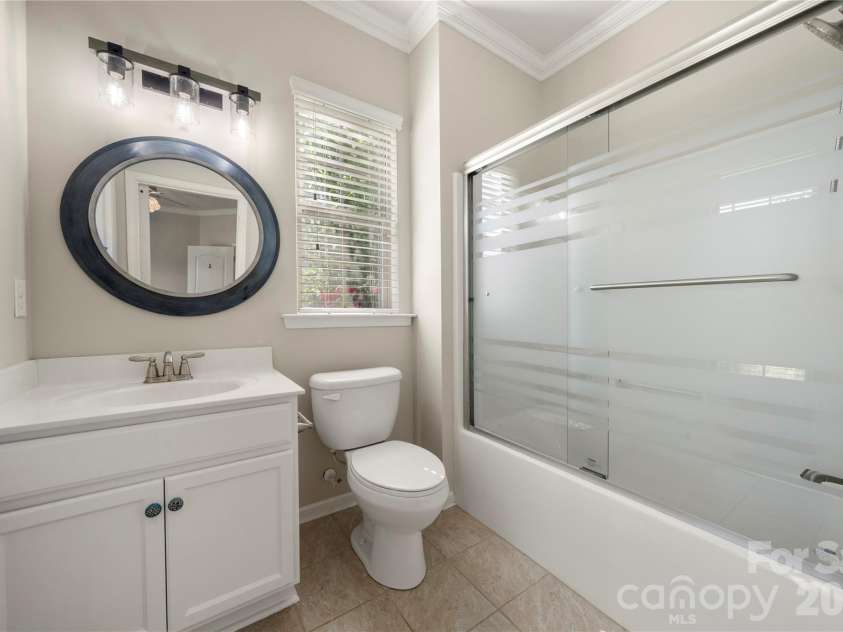 13929 Tilesford Lane, Huntersville, NC 28078.  MLS# CAR4199840, YatesRealty ID 23428. Main level guest suite bathroom