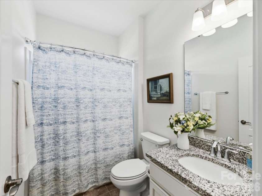 5116 Lassen Volcanic Trail, Lancaster, SC 29720.  MLS# CAR4377413, YatesRealty ID 23434. Full Bath for Bedrooms 2 & 3 with Tiled Flooring and Granite Counters at Vanity