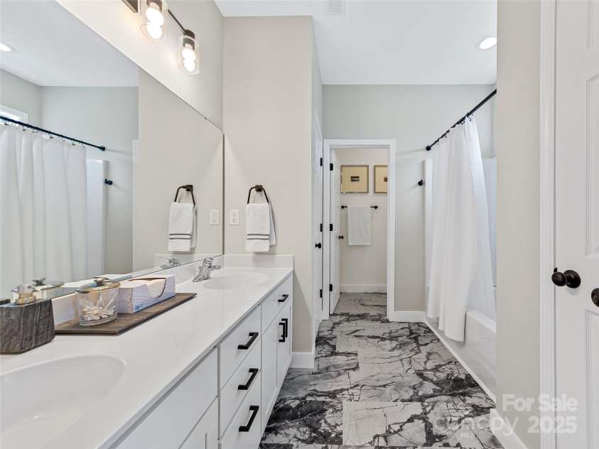 218 Water Leaf Drive, Weaverville, NC 28787.  MLS# CAR4266652, YatesRealty ID 23436. Ensuite primary bath