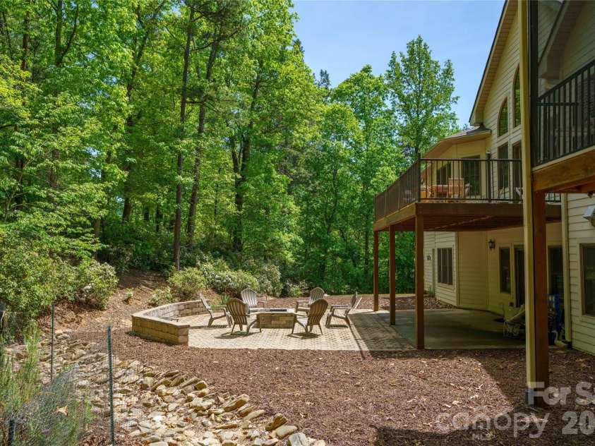 176 Hemlock Lane, Lake Lure, NC 28746.  MLS# CAR4374433, YatesRealty ID 23437. Back yard with patio and firepit
