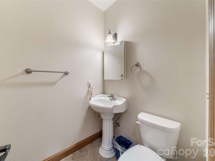 176 Hemlock Lane, Lake Lure, NC 28746.  MLS# CAR4374433, YatesRealty ID 23437. Half bath main floor