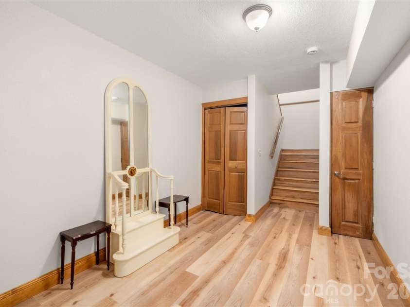 176 Hemlock Lane, Lake Lure, NC 28746.  MLS# CAR4374433, YatesRealty ID 23437. Lower hallway