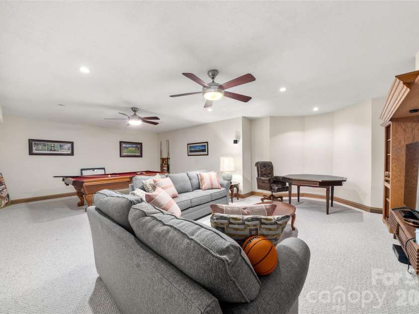 176 Hemlock Lane, Lake Lure, NC 28746.  MLS# CAR4374433, YatesRealty ID 23437. Lower level rec room
