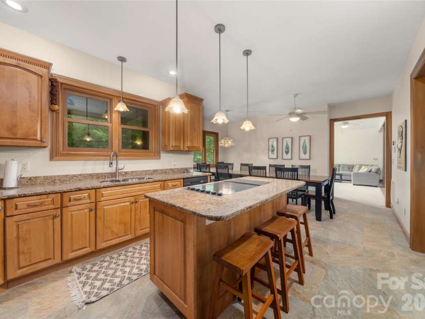 176 Hemlock Lane, Lake Lure, NC 28746.  MLS# CAR4374433, YatesRealty ID 23437. Main level kitchen