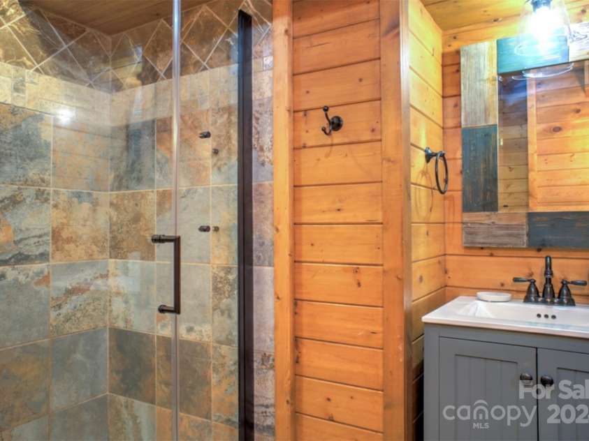 140 Camby Drive, Fairview, NC 28730.  MLS# CAR4178451, YatesRealty ID 2344. Downstairs bath