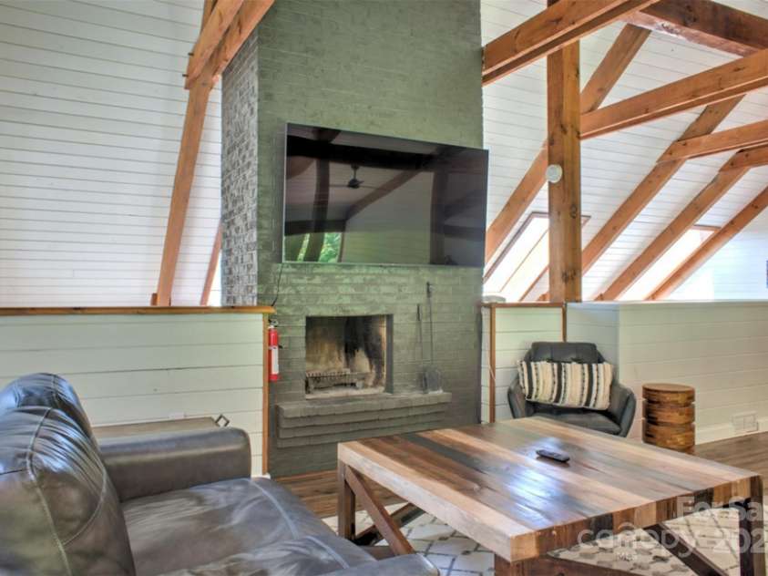 140 Camby Drive, Fairview, NC 28730.  MLS# CAR4178451, YatesRealty ID 2344. Loft - now with new electric fireplace