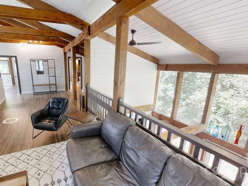 140 Camby Drive, Fairview, NC 28730.  MLS# CAR4178451, YatesRealty ID 2344. Upstairs loft looking down on dining room