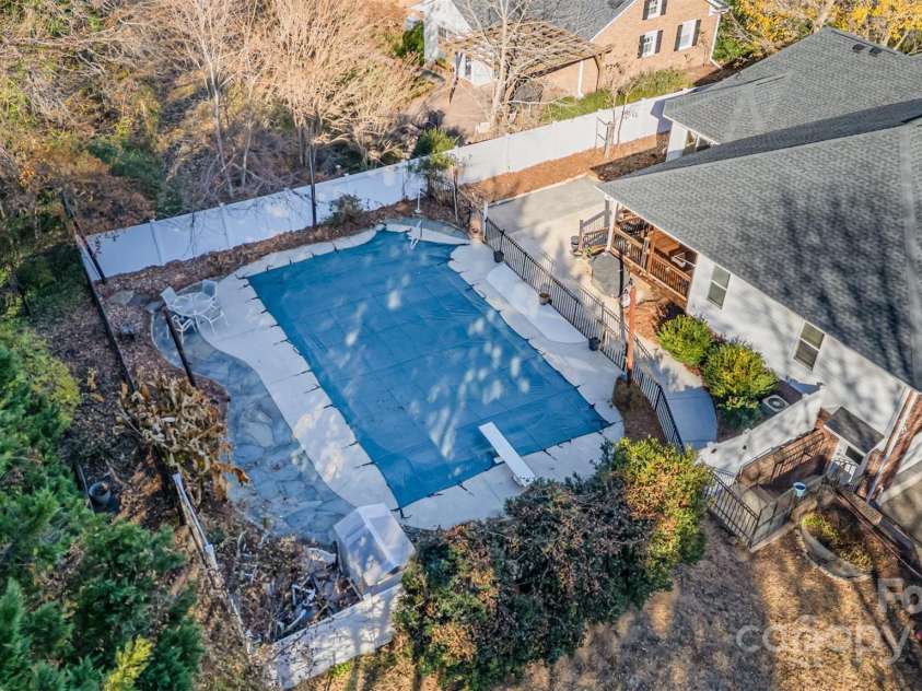 300 Gloucestershire Road, Winston Salem, NC 27104.  MLS# CAR4321606, YatesRealty ID 2344. Aerial of pool and house