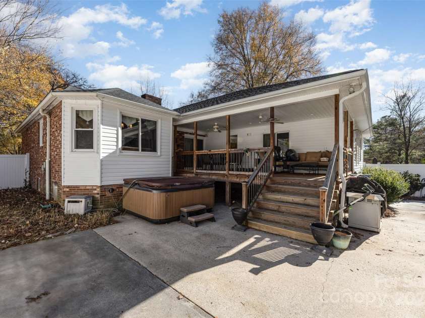 300 Gloucestershire Road, Winston Salem, NC 27104.  MLS# CAR4321606, YatesRealty ID 2344. Rear of Home with view of covered porch and hot tub