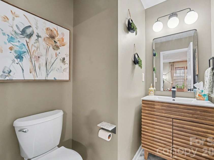 8331 Christmas Court, Charlotte, NC 28216.  MLS# CAR4340042, YatesRealty ID 2344. Powder room fully remodeled with new vanity, new toilet, new fixtures & light fixtures, fresh paint, new marble floors, new door knops, hinges and more..